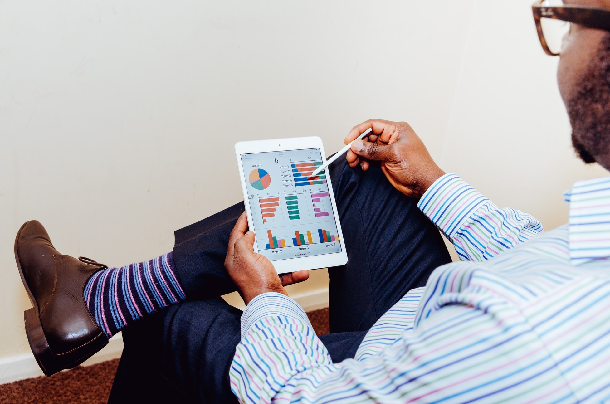 Photo of a man looking at a financial dashboard by Adeolu Eletu on Unsplash