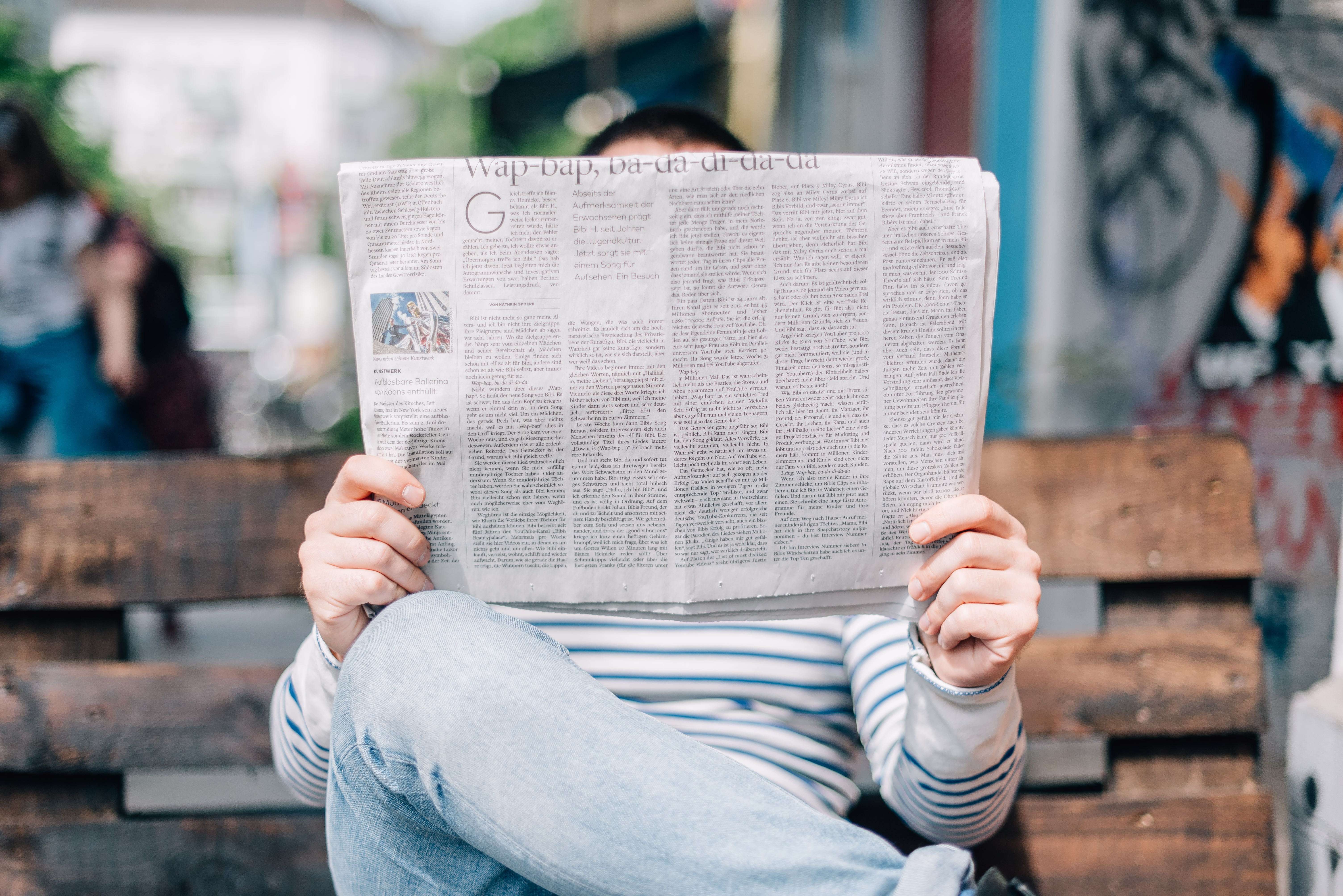 Photo of a man reading the newspaper by Roman Kraft on Unsplash